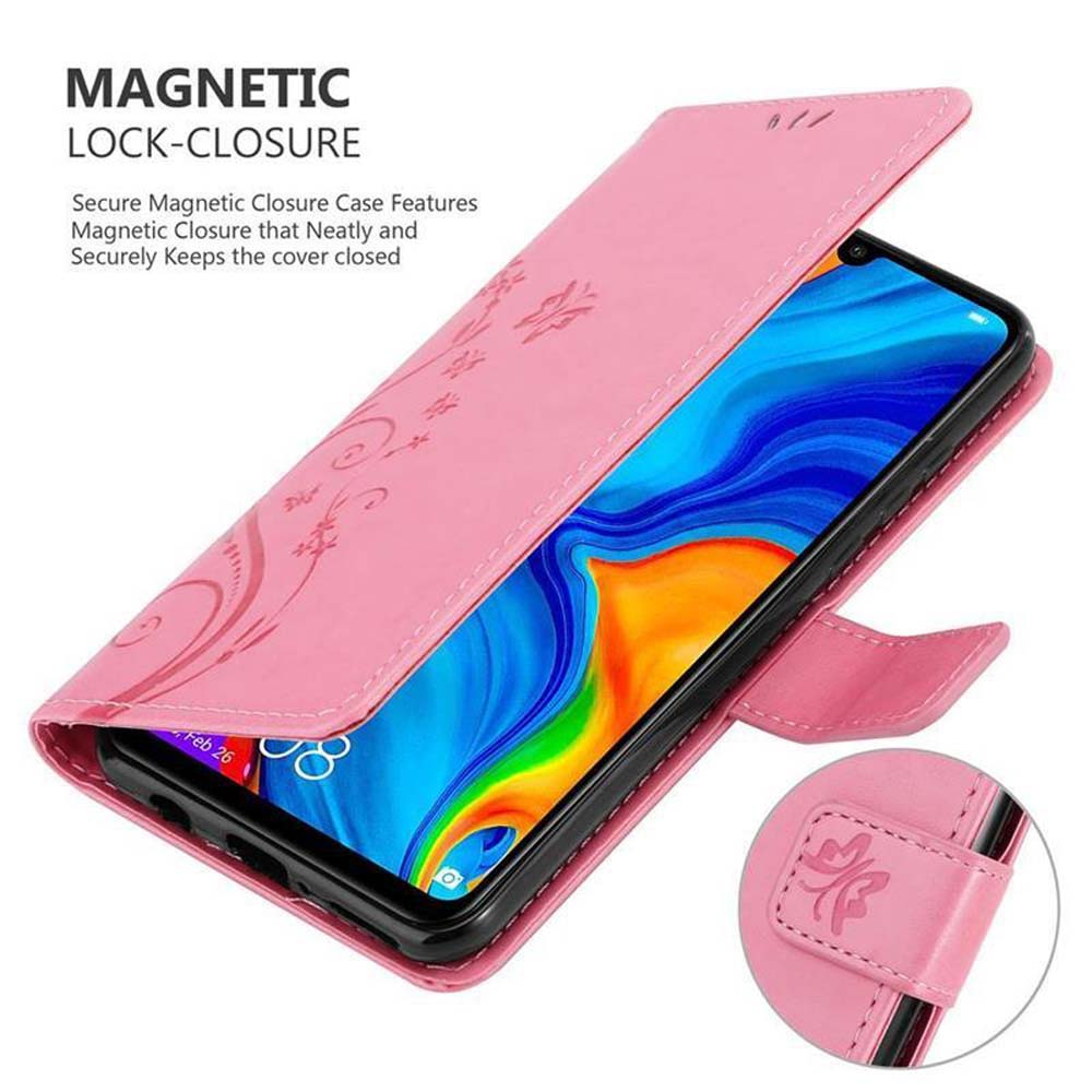 Una custodia rosa per telefono aperta per rivelare un telefono, decorata con motivi floreali.