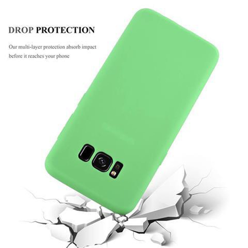 Viene mostrata una custodia per telefono verde, con un telefono all'interno, ed è posizionata su una superficie incrinata.