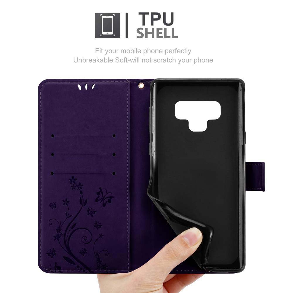 Custodia per telefono viola, aperta. Il telefono è dentro. La custodia è decorata con fiori.