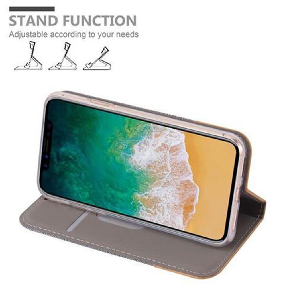 Telefono in una custodia grigia, aperto per creare un supporto. Lo schermo mostra una scena di spiaggia.