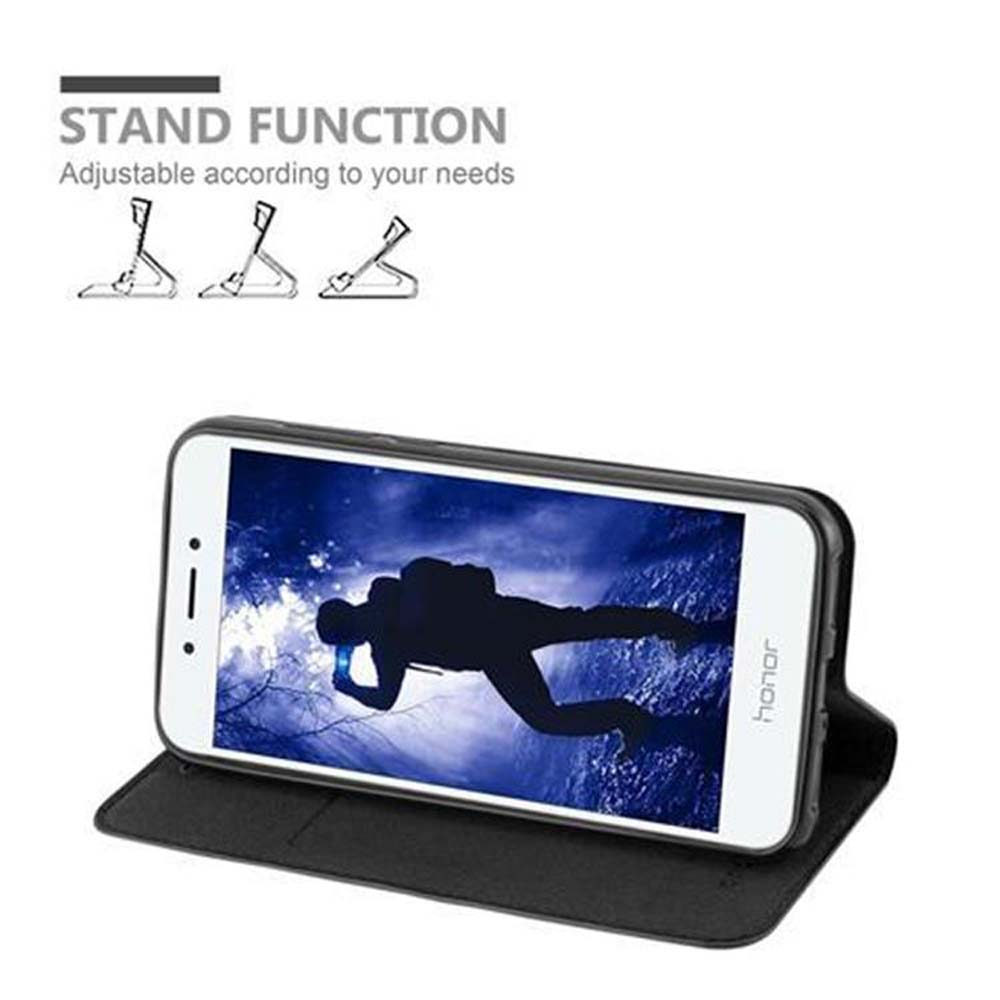 Telefono in custodia, appoggiato. Una persona guarda un video. Testo: Stand Function.