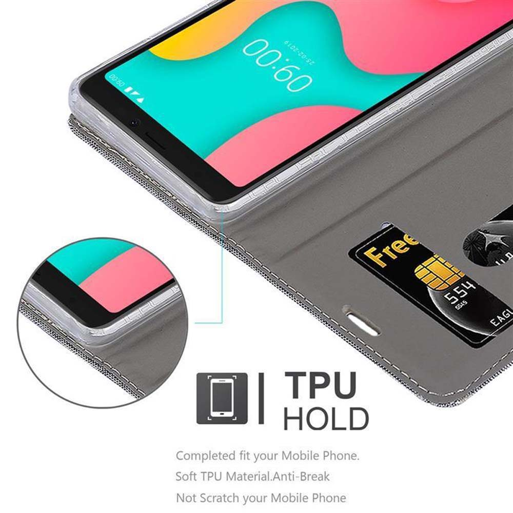 Telefono in una custodia a portafoglio grigia. Una carta di credito è nello slot. Lo schermo del telefono mostra 00:00. Il testo recita 'TPU HOLD'.