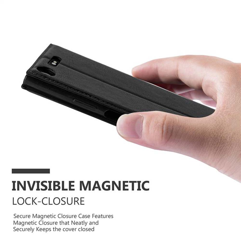Una mano tiene una custodia per telefono nera chiusa. Il testo recita: Chiusura a blocco magnetico invisibile.