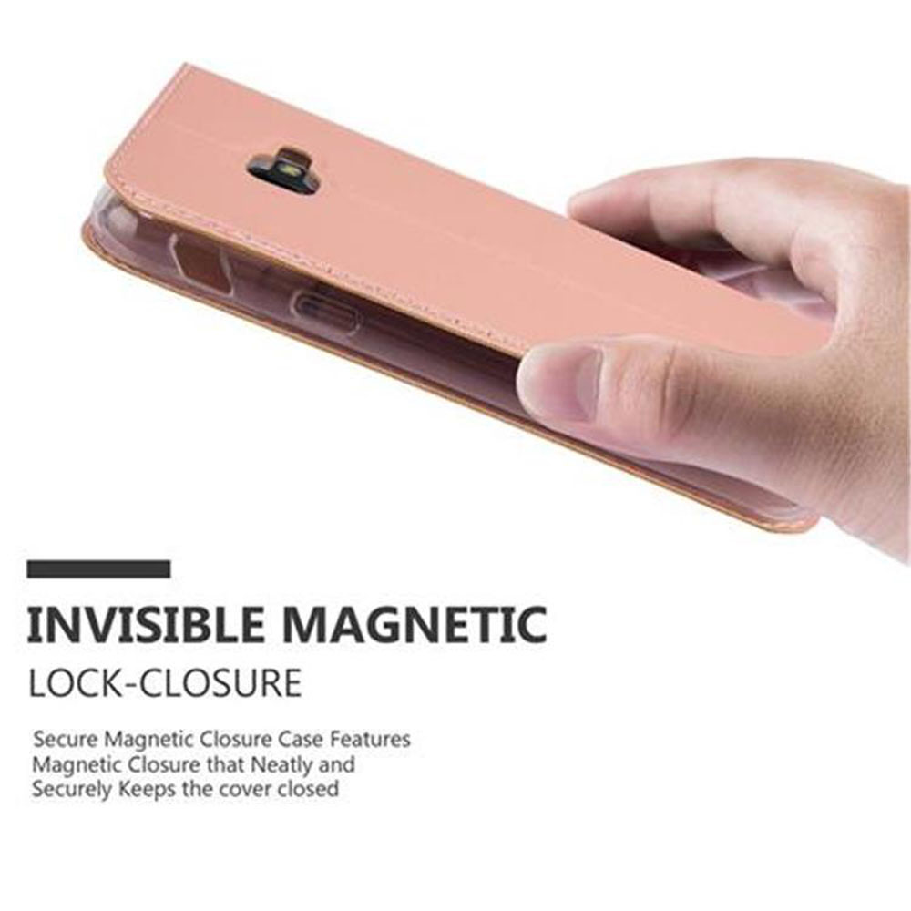 Una mano che tiene una custodia rosa per telefono aperta, con un telefono all'interno.