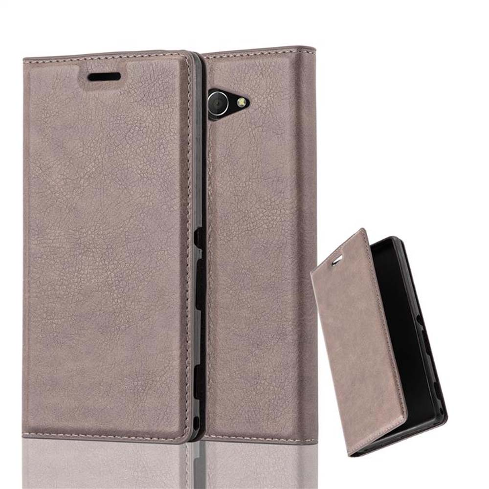 Funda de teléfono, marrón claro, abierta para revelar un teléfono. Otra funda está detrás y abierta.
