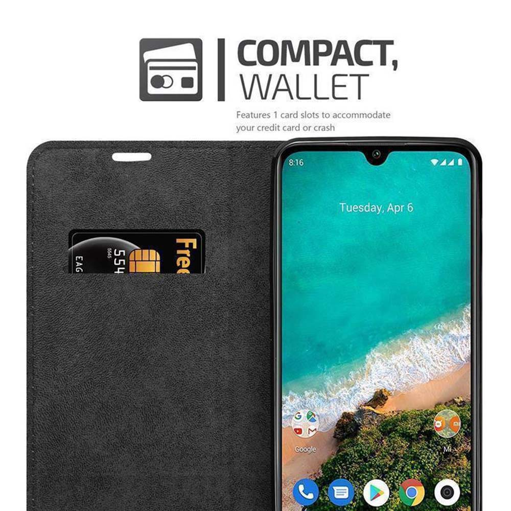 Schwarze Handyhülle mit Telefon und Kreditkarte. Das Telefon zeigt die Uhrzeit und Apps.