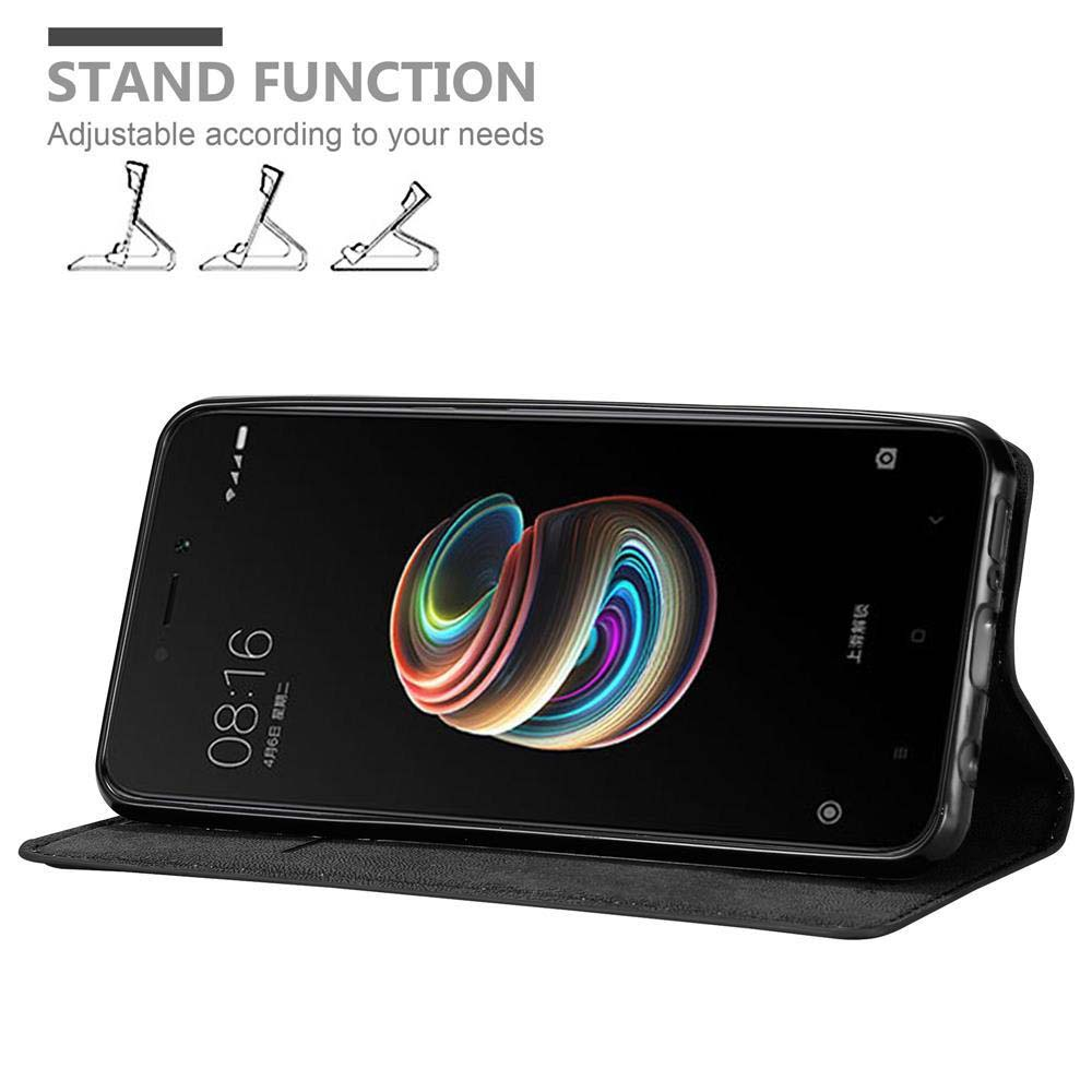 Uno smartphone in una custodia nera, che mostra un design astratto colorato. Testo: Funzione stand.
