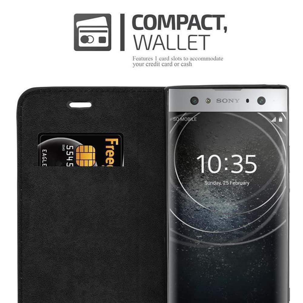 Funda negra con tarjeta de crédito y teléfono. El teléfono muestra una pantalla con un reloj.