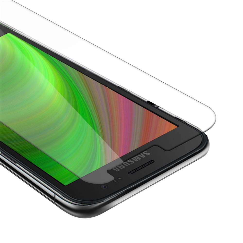Una protezione per lo schermo del telefono è posizionata su un telefono nero. Il telefono ha un display verde e bianco.