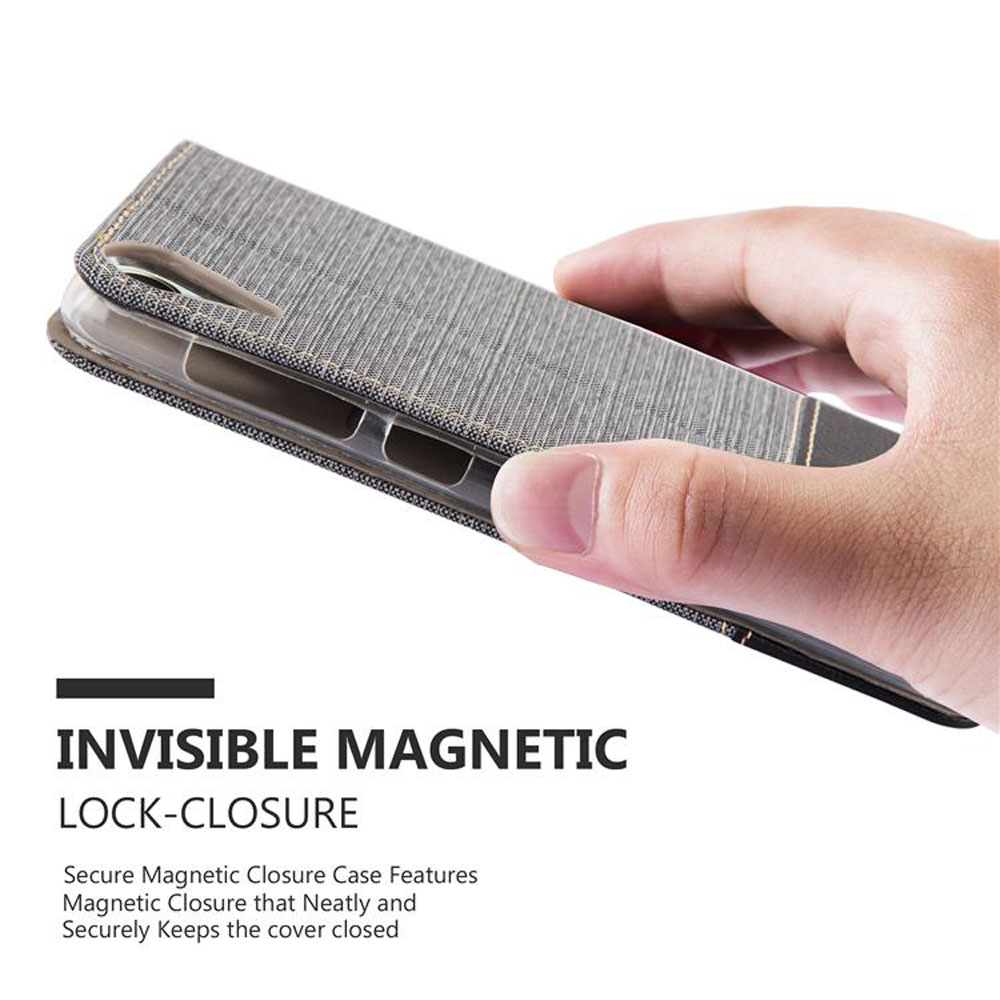 Mano che tiene una custodia grigia, con le parole 'Invisible Magnetic Lock-Closure'.