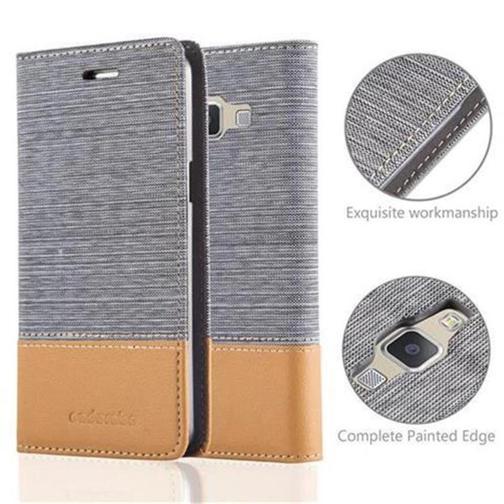 Una funda de teléfono en gris y marrón. El texto dice, exquisita mano de obra y borde completamente pintado.