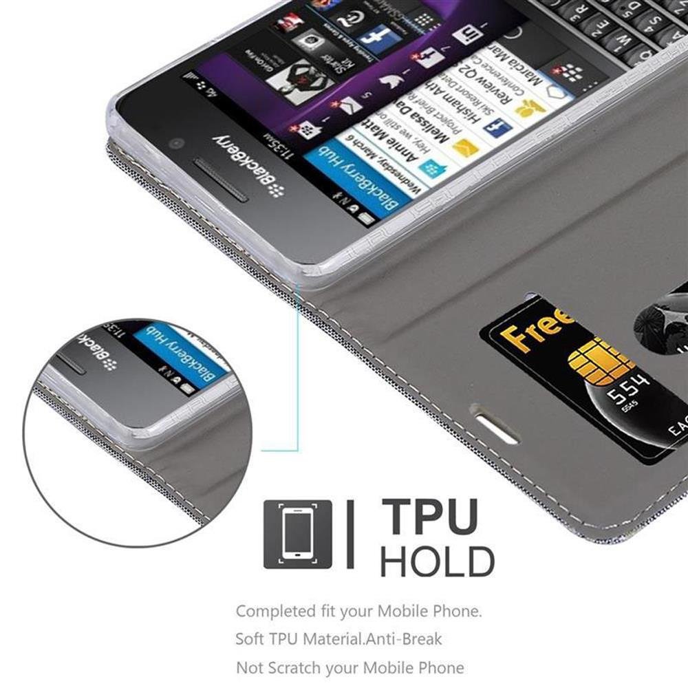 Eine offene Handyhülle mit einem Telefon darin. Eine Karte befindet sich auf der linken Innenseite. Text: TPU HOLD.
