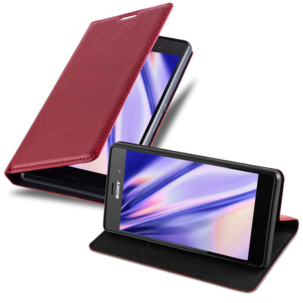 Un teléfono en una funda roja, con la funda abierta. El teléfono es negro y tiene pantalla visible.