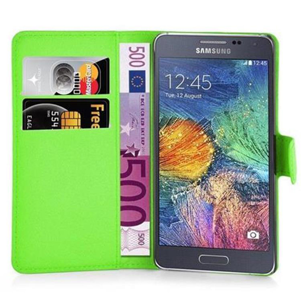 Una custodia per telefono verde con un telefono all'interno, che mostra denaro e carte.