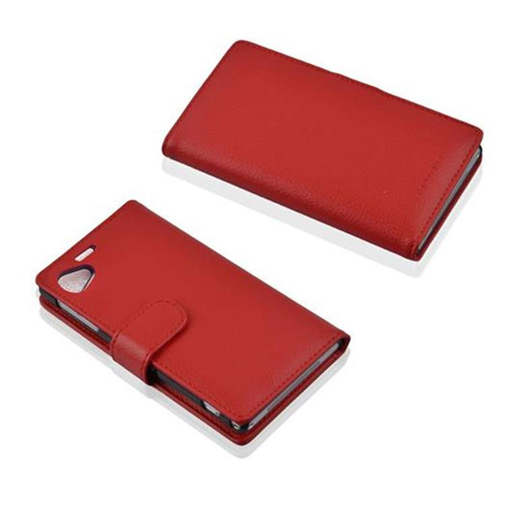 Due custodie rosse per telefono, una aperta e una chiusa, che mostrano una texture in pelle.