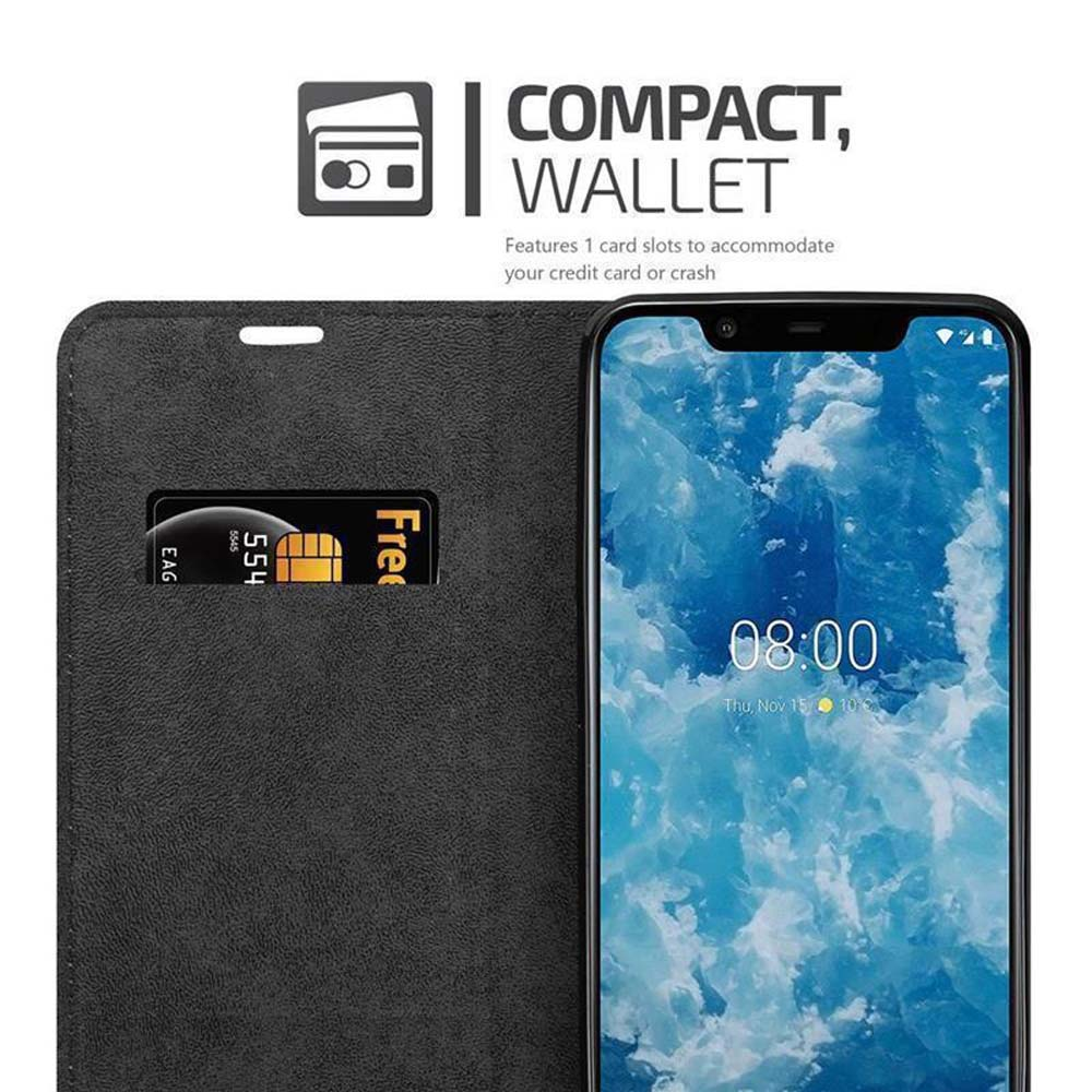 Eine schwarze Handyhülle mit Kreditkartenfach und ein Telefon, das die Uhrzeit anzeigt, wird angezeigt.