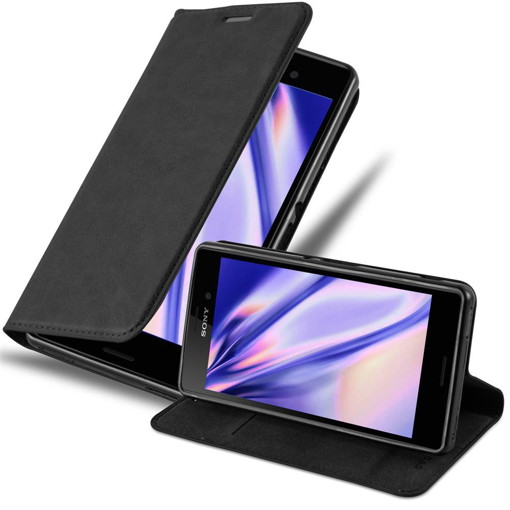 Teléfono negro en funda abierta. Otro teléfono en el fondo, también en funda.