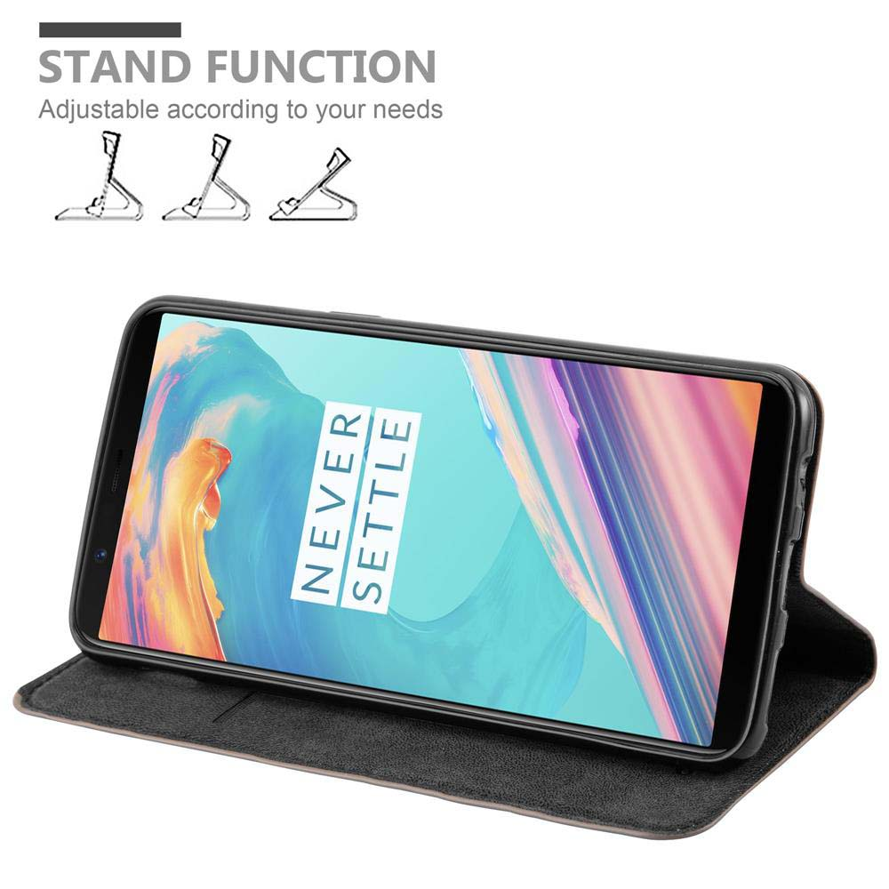 Telefon in Brieftasche, zum Betrachten aufgestellt. Text: Standfunktion. Die Hülle ist schwarz.