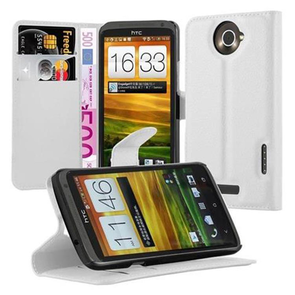 Un telefono in una custodia bianca e diversi accessori. Il telefono mostra un'interfaccia.