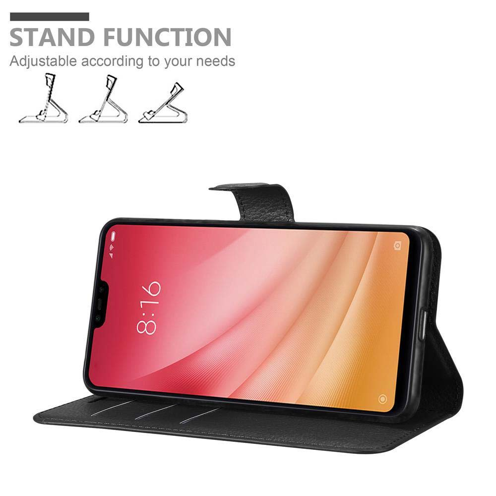 Telefono in una custodia, in piedi. La custodia è aperta. Mostra lo schermo del telefono con data e ora. Funzione stand.