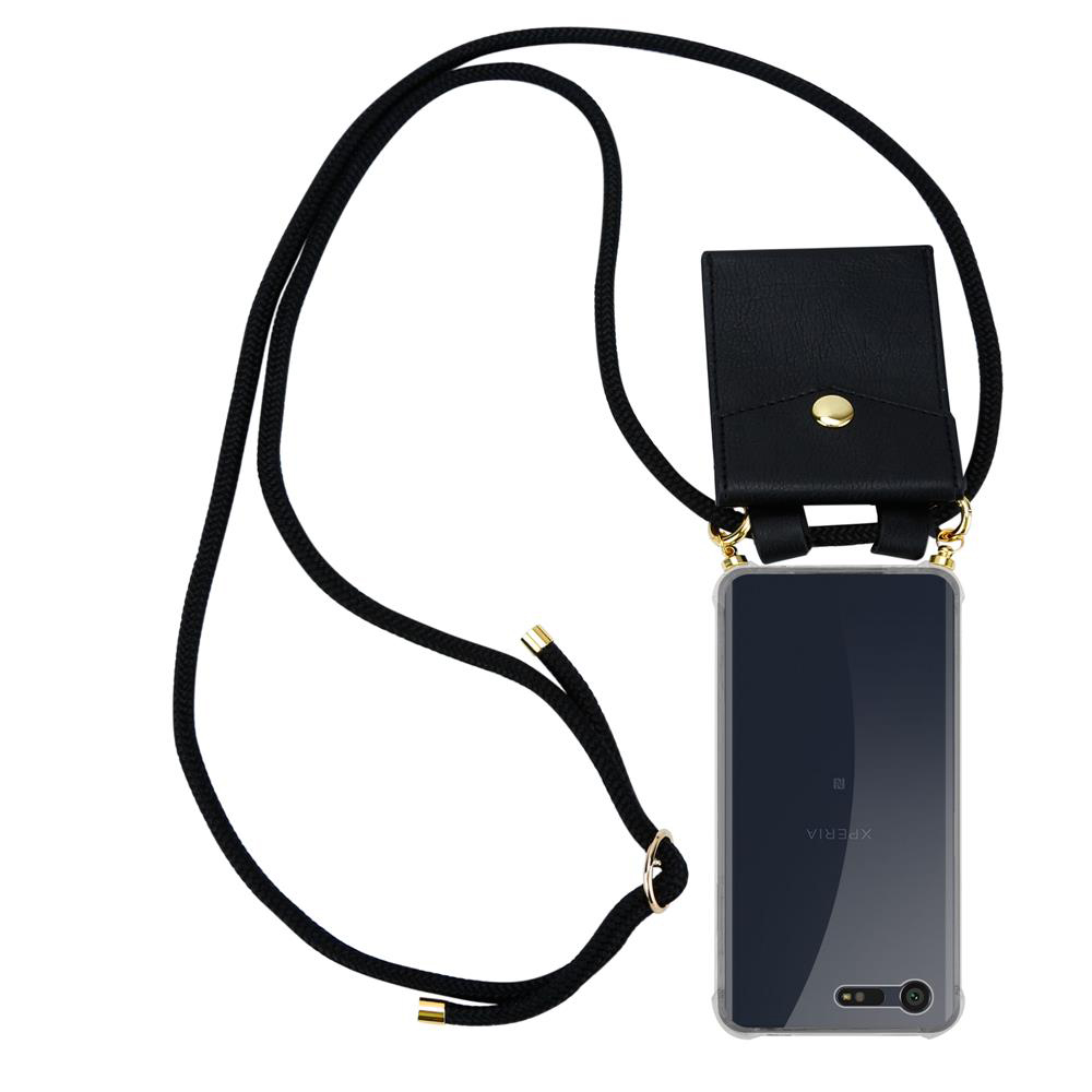 Un teléfono negro en una funda transparente con una correa negra. Una pequeña bolsa negra cuelga de la correa.
