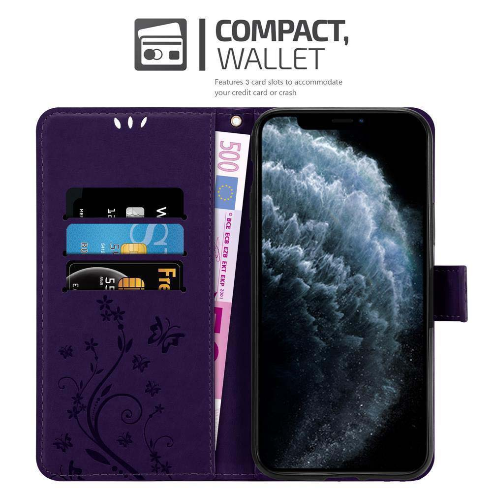 Custodia a portafoglio viola con telefono e carte. Mostra design floreale, schermo del telefono e denaro.