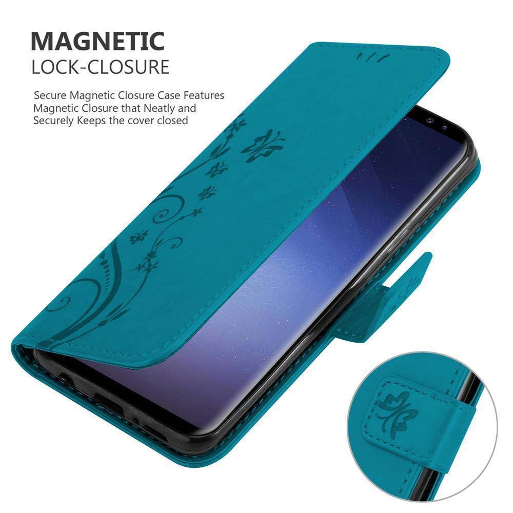 Custodia turchese con design floreale, aperta per rivelare il telefono. Chiusura magnetica visibile.