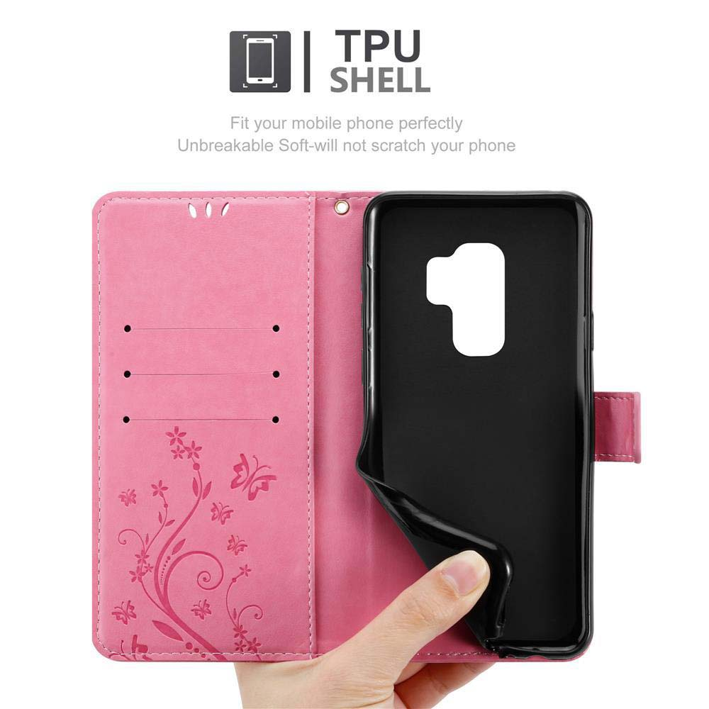 Una custodia per telefono rosa con un design floreale, a forma di telefono. La custodia è aperta.