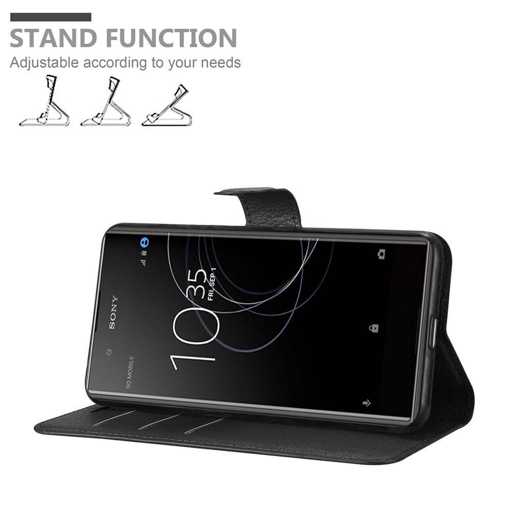 Schwarzes Telefon in schwarzem Case, aufgestellt. Bildschirm zeigt Uhrzeit und Datum. Standfunktion.