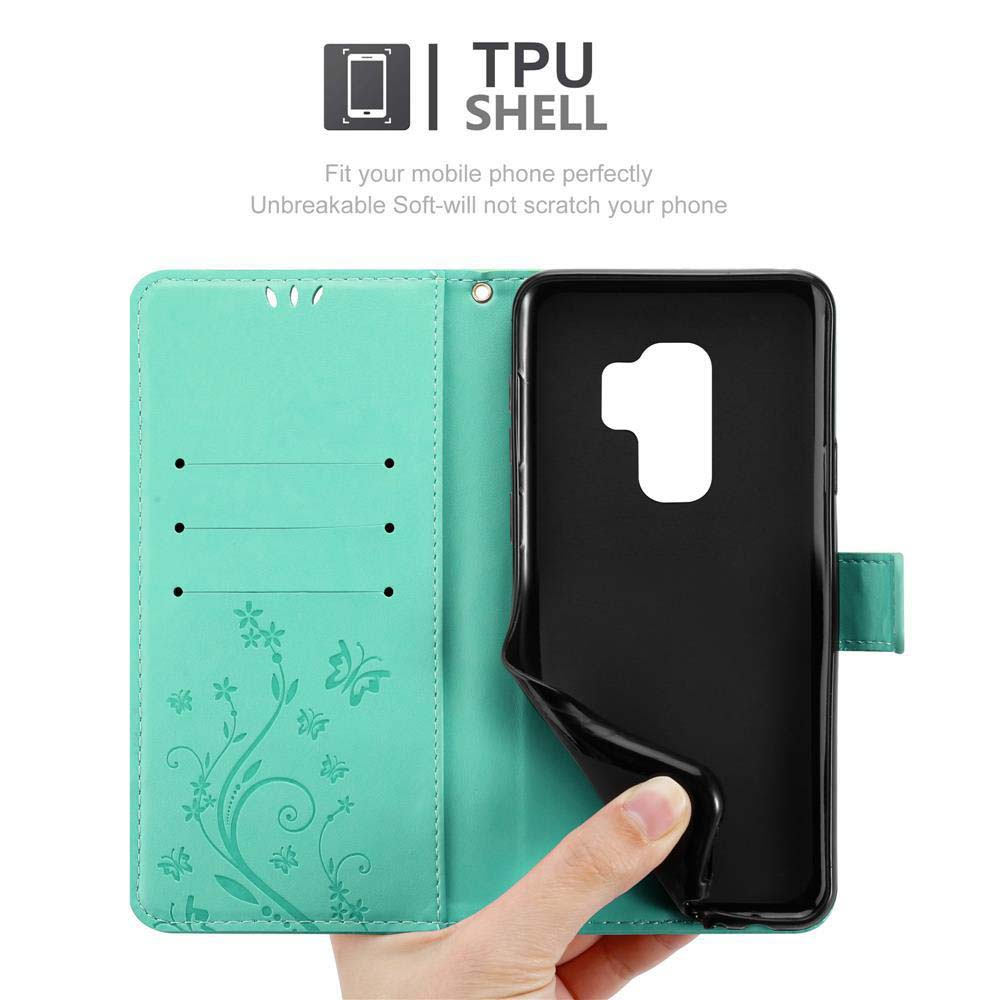 Custodia del telefono aperta. Interno verde menta, con supporto nero.