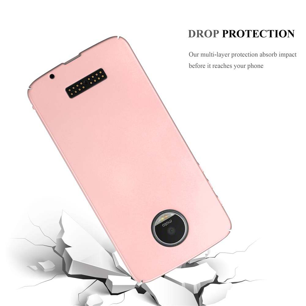 Custodia per telefono rosa appoggiata su cemento rotto. Testo: Protezione dalle cadute. Logo Moto.