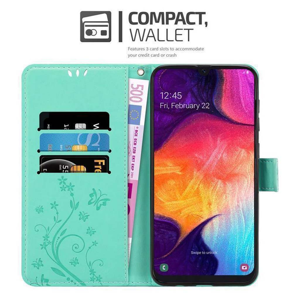 Custodia per telefono con carte e denaro. Il telefono mostra uno schermo. Verde acqua, design floreale, stile portafoglio.