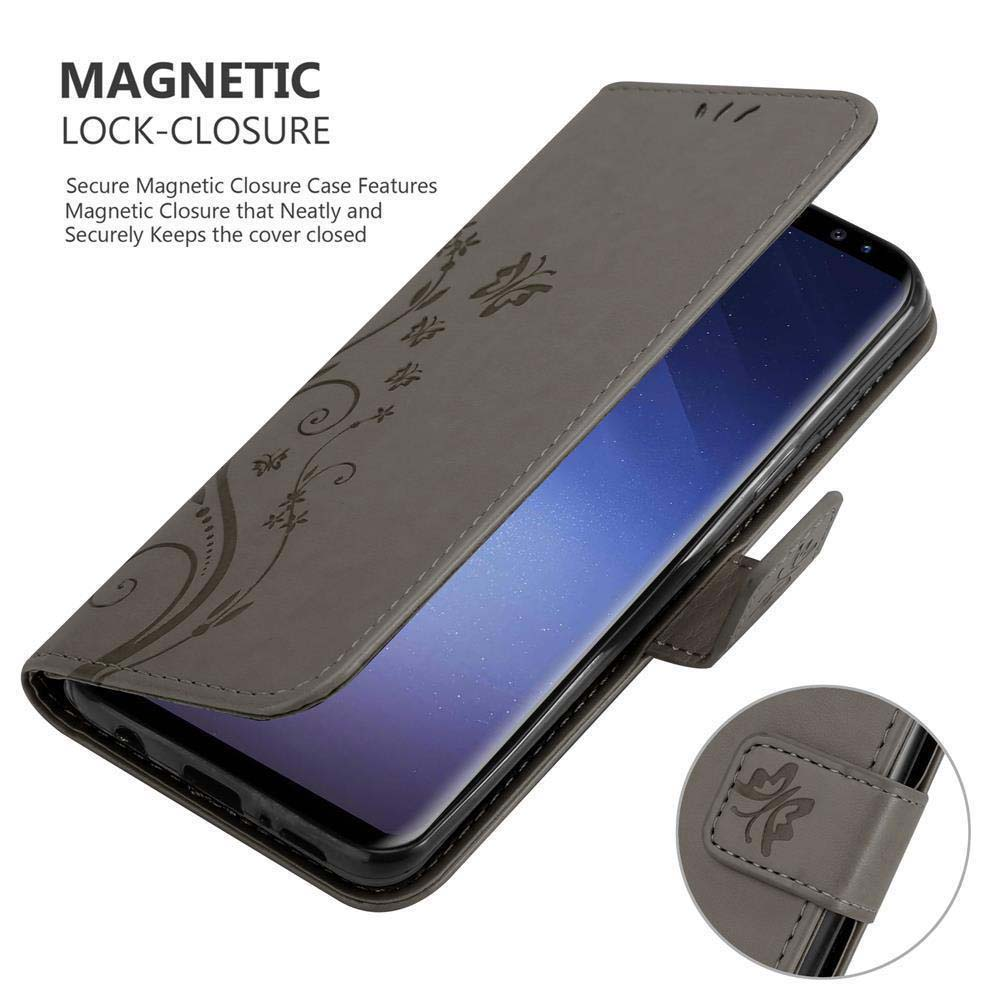 Custodia grigia per telefono con design floreale, aperta per rivelare uno smartphone. Chiusura magnetica mostrata.
