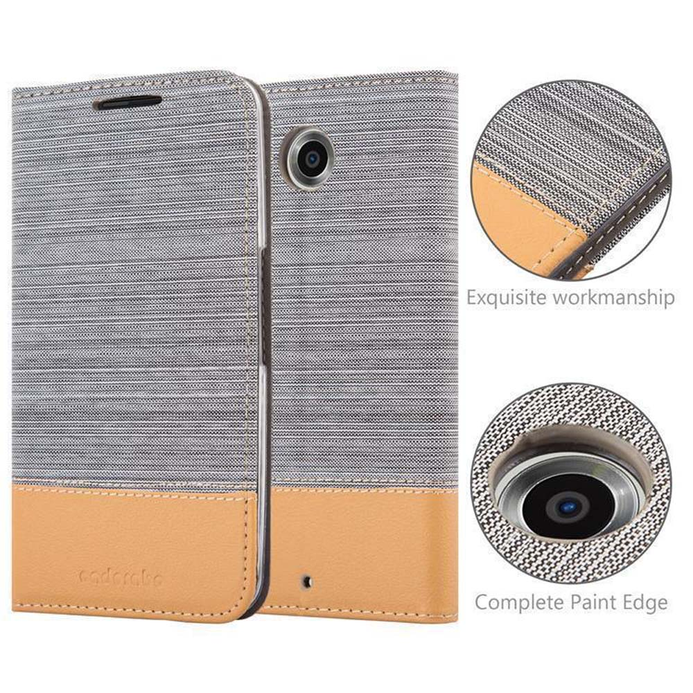 Funda de teléfono gris con teléfono dentro. La funda está abierta. La funda tiene un borde de pintura completo.