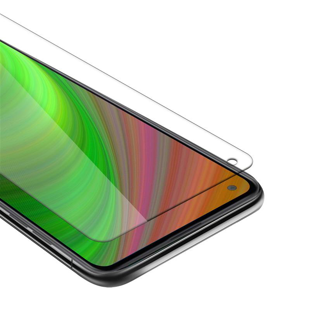 Un proteggi schermo è posizionato sullo schermo di un telefono, con il display colorato del telefono visibile.
