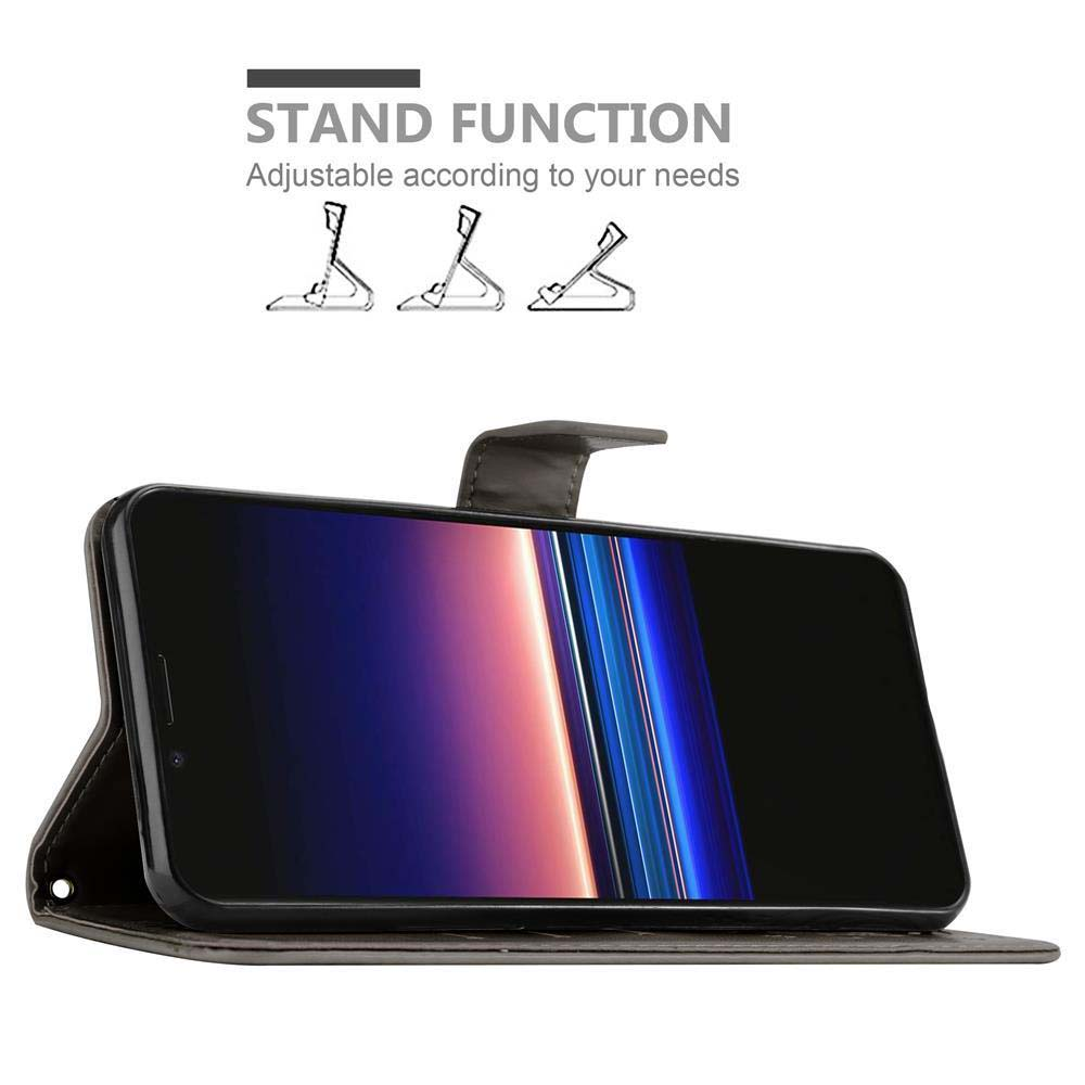 Un telefono in una custodia che si apre come un libro. Il telefono mostra un display colorato.