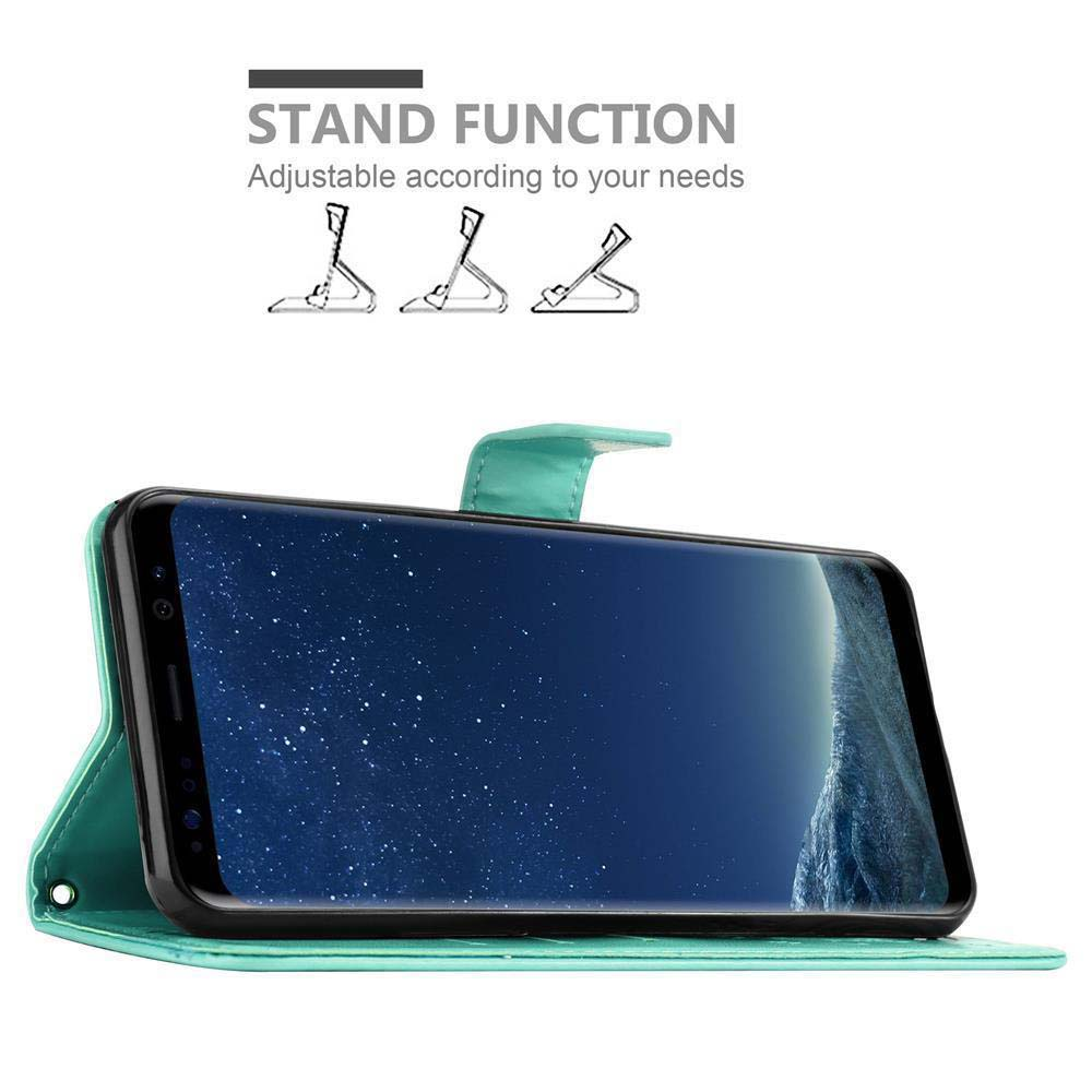 Telefono in custodia verde acqua, in piedi con funzione stand. Il telefono mostra uno sfondo astratto blu.