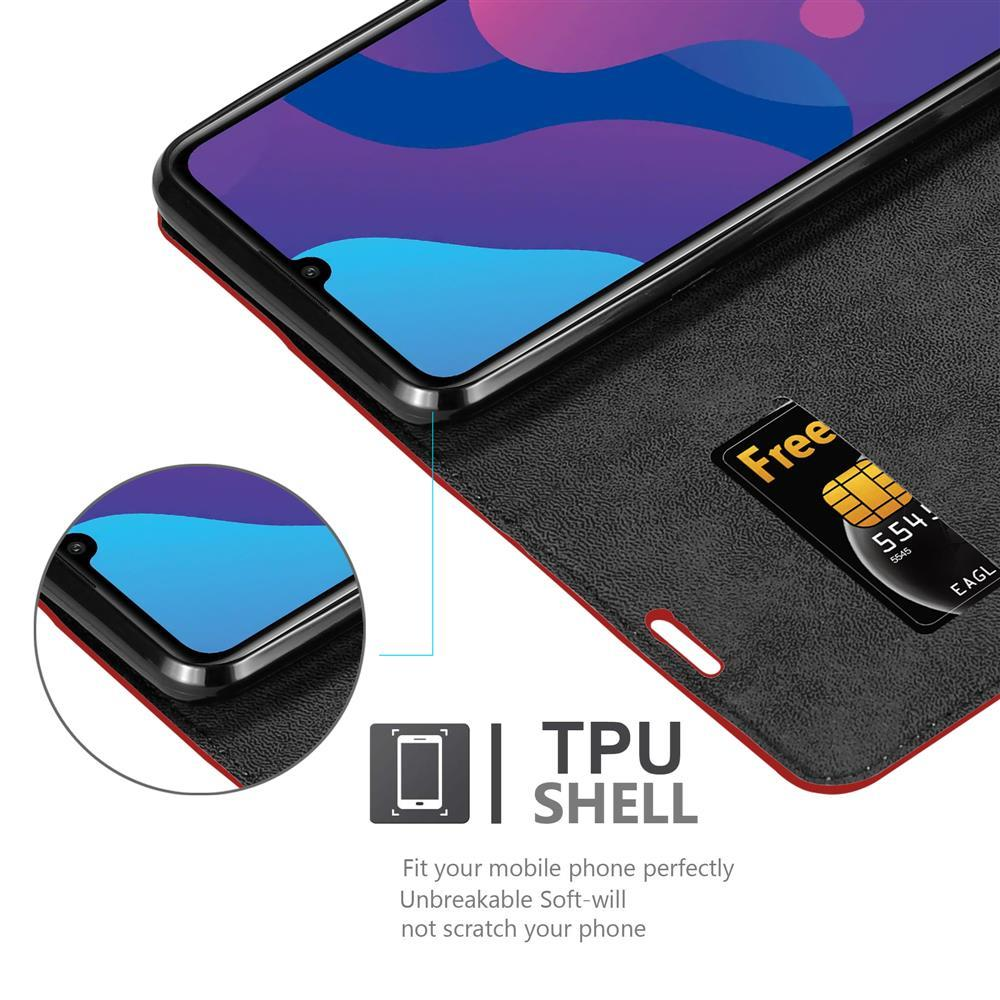 Un telefono in una custodia nera con una carta, uno schermo con schermata iniziale. Testo: 'TPU SHELL'.