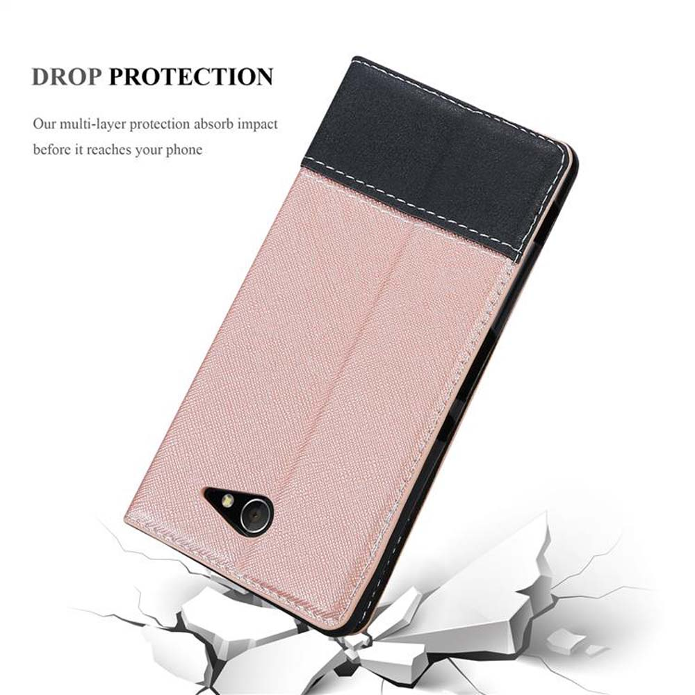 Custodia rosa per telefono con dettagli bianchi e neri, su terreno bianco rotto.