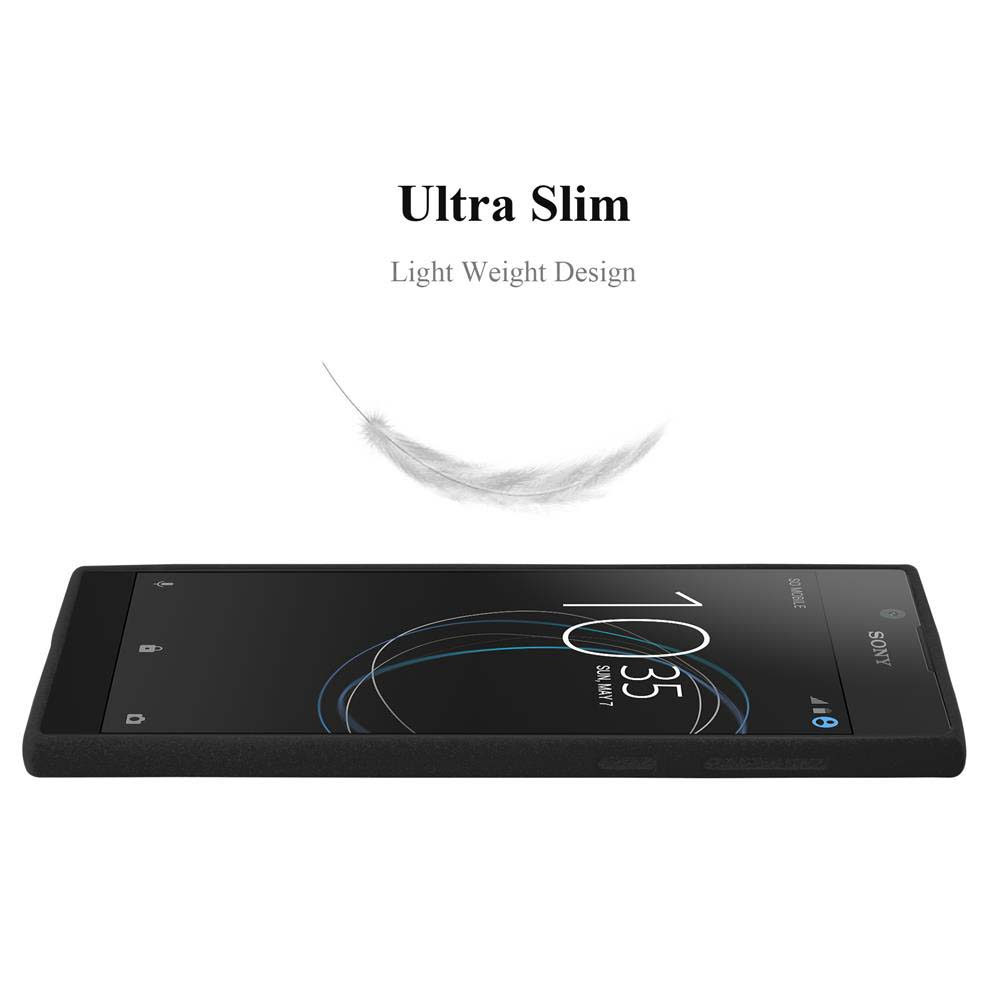 Un telefono nero e una piuma su una superficie nera, e luce.