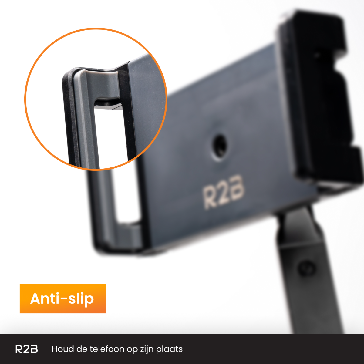 Nahaufnahme eines Telefonhalters mit orangefarbenem Text. Der Halter ist grau und schwarz.