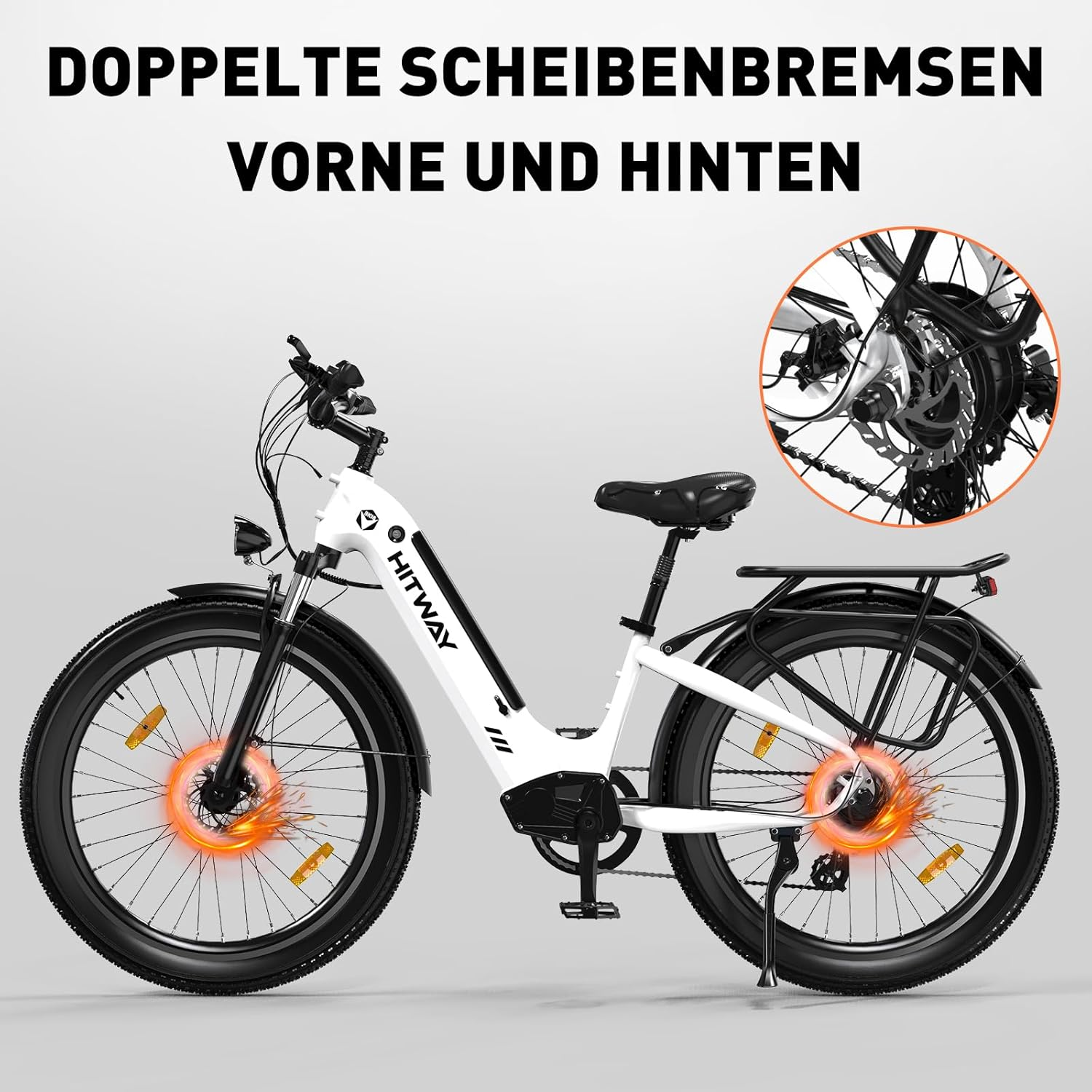 Una bicicletta elettrica bianca e nera con dettagli arancioni sulle ruote, con il testo 'Doppelte Scheibenbremsen'.