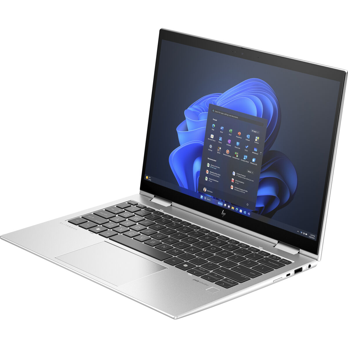 Ordenador portátil plateado abierto sobre una superficie blanca. La pantalla muestra una interfaz de Windows.
