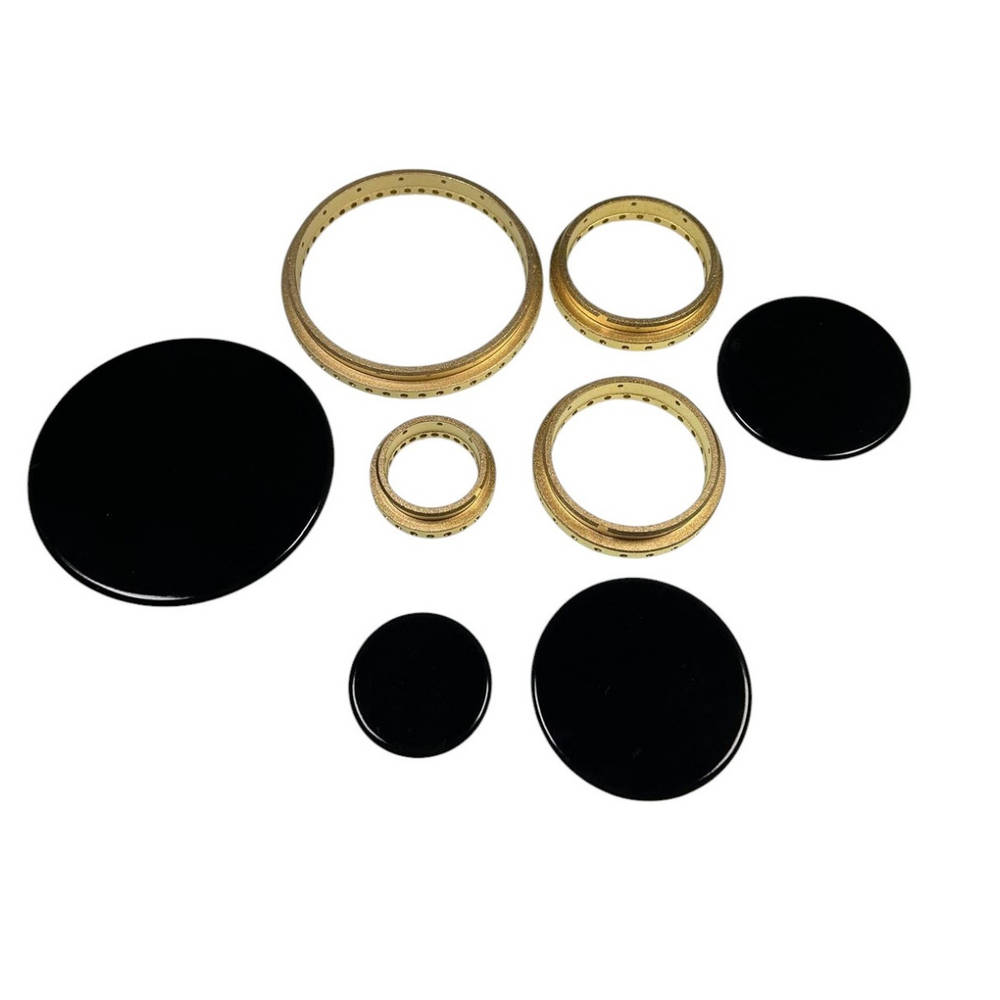 Elementos de quemador de estufa negros y dorados. Incluye dos anillos grandes, dos medianos y dos pequeños.