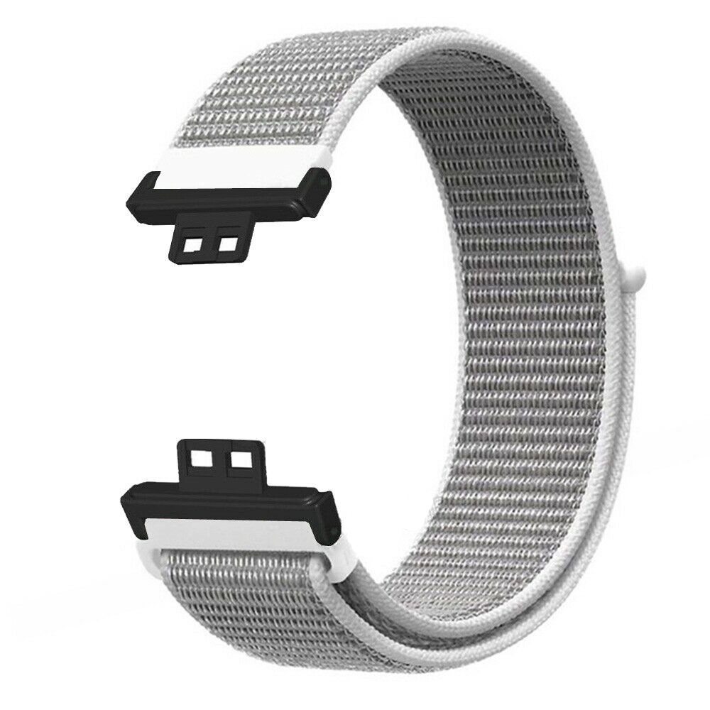 Armband, grauer Stoff, schwarze und weiße Anschlüsse.