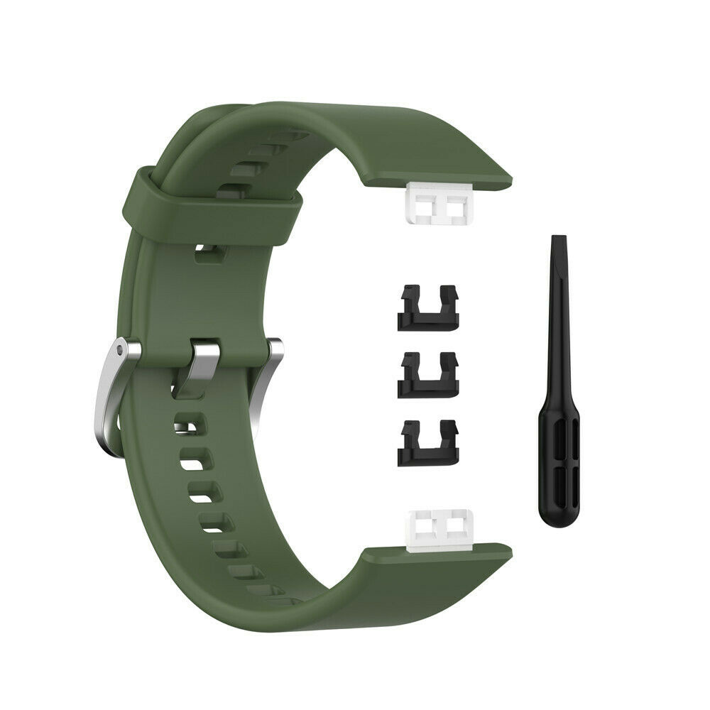 Grünes Uhrenarmband mit Aufsätzen und einem Werkzeug.