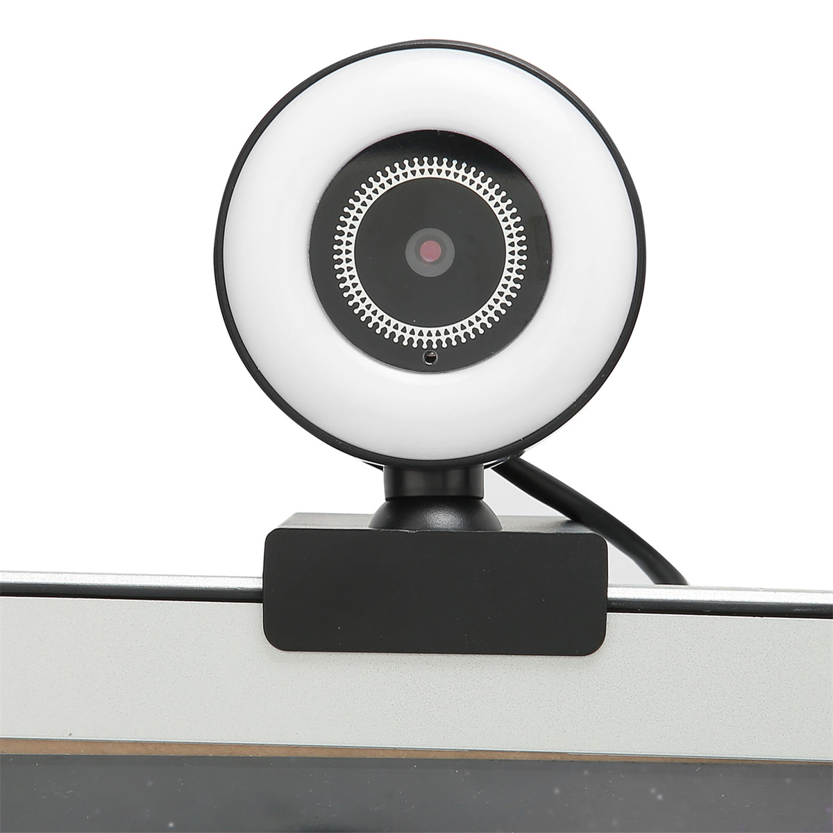 Webcam mit Ringlicht. Sie hat einen schwarzen Sockel und sitzt auf einem Monitor.
