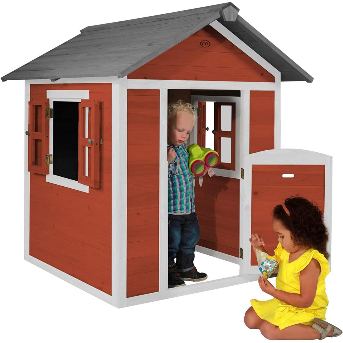 Kinderspielhaus in Rot und Weiß, mit zwei Kindern, eines drinnen, eines draußen.