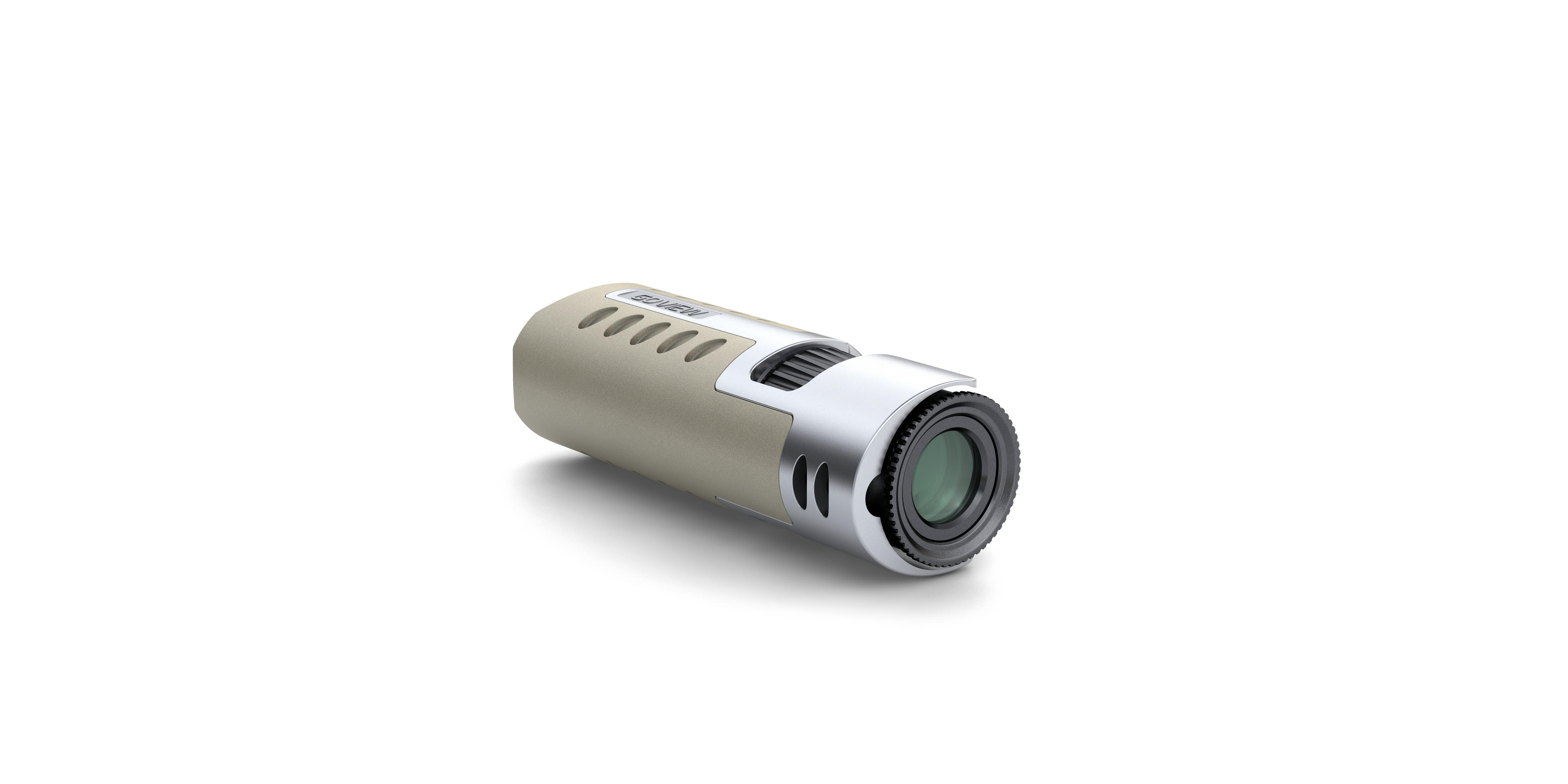 Una fotocamera o registratore portatile beige e argento, appoggiato su sfondo bianco.