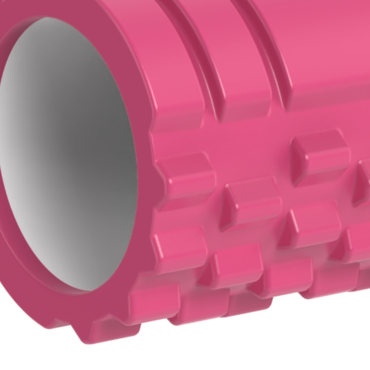 Roze foamroller met geribbeld oppervlak en grote centrale opening, close-up.